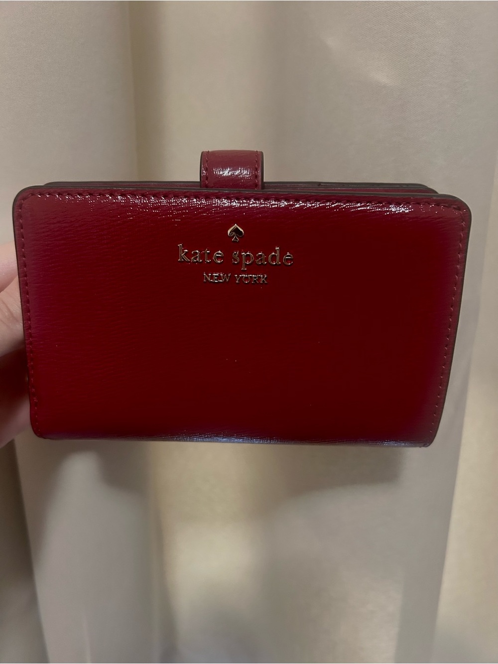kate spade glossy red leather wallet with gold logo